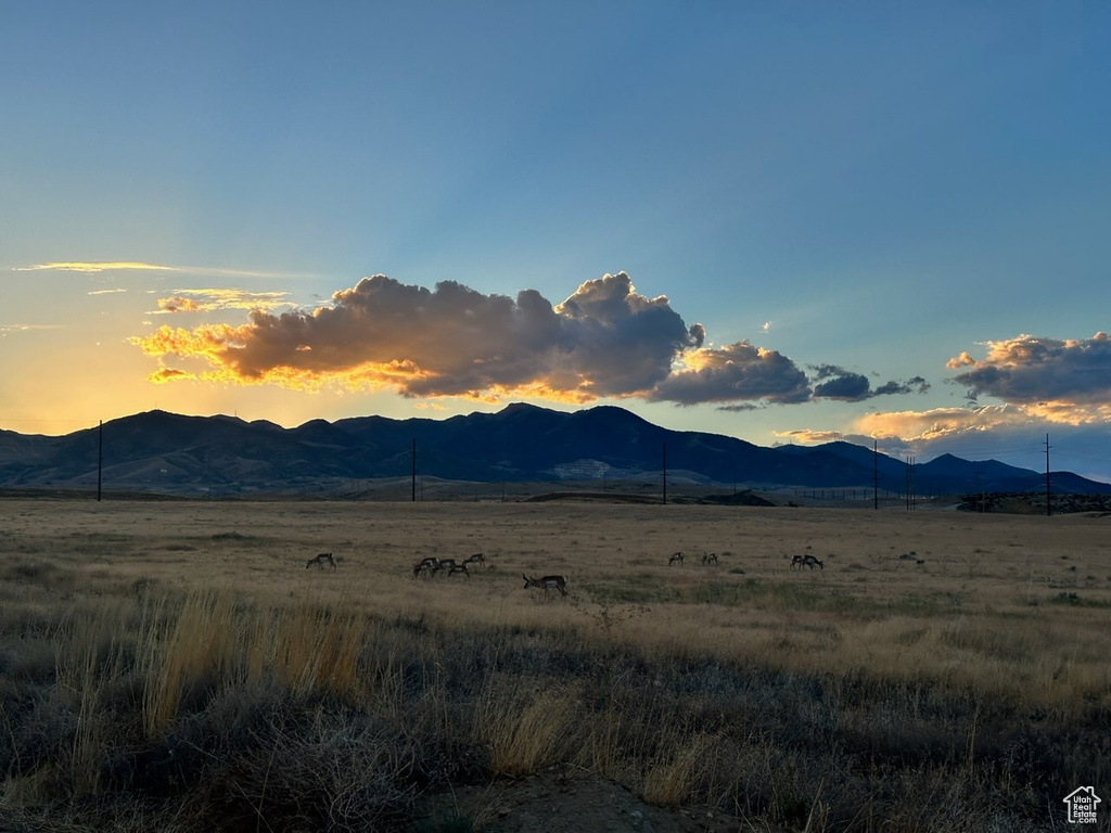 View of mountain background featuring rural landscape