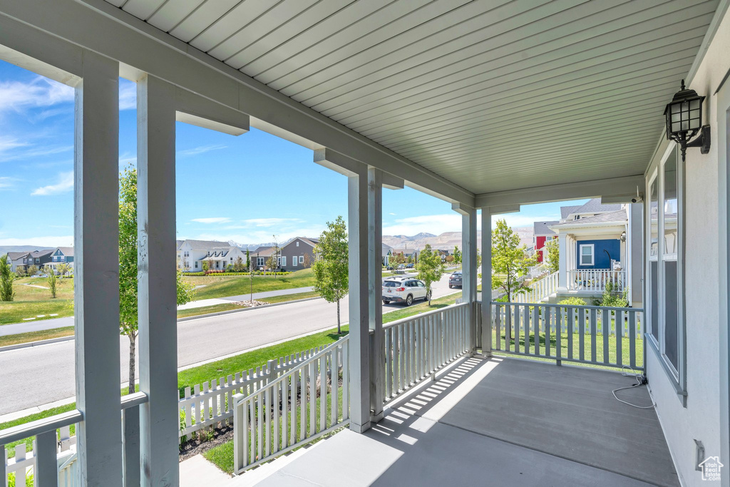 Covered porch with a residential view