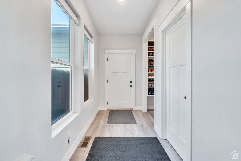 Entryway featuring light wood-style flooring and baseboards