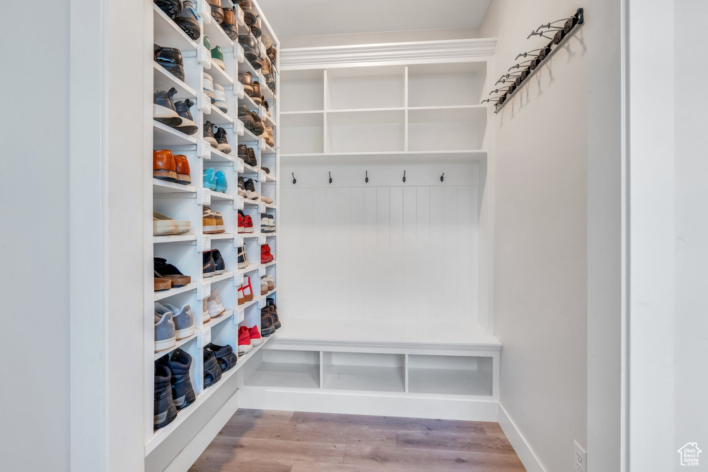 Mudroom featuring wood finished floors and baseboards