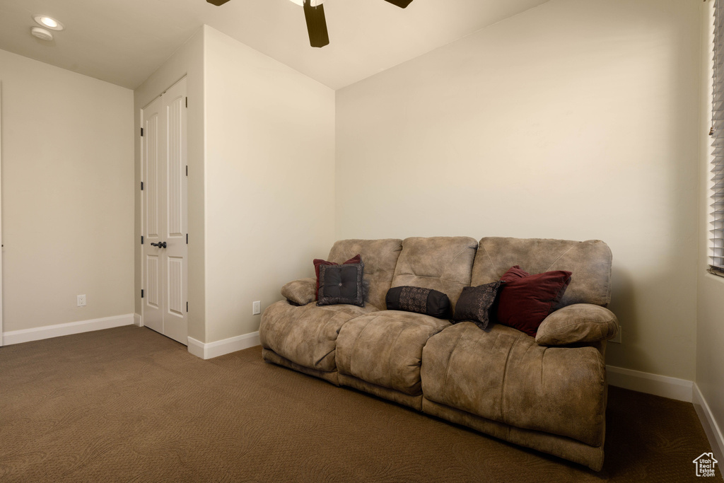 Carpeted living area featuring ceiling fan, baseboards, lofted ceiling, and recessed lighting