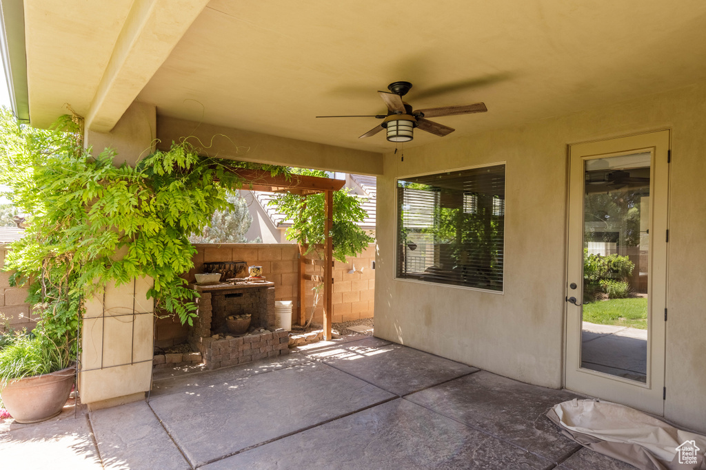 View of patio featuring ceiling fan