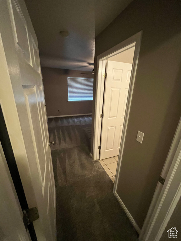 Hallway featuring carpet floors