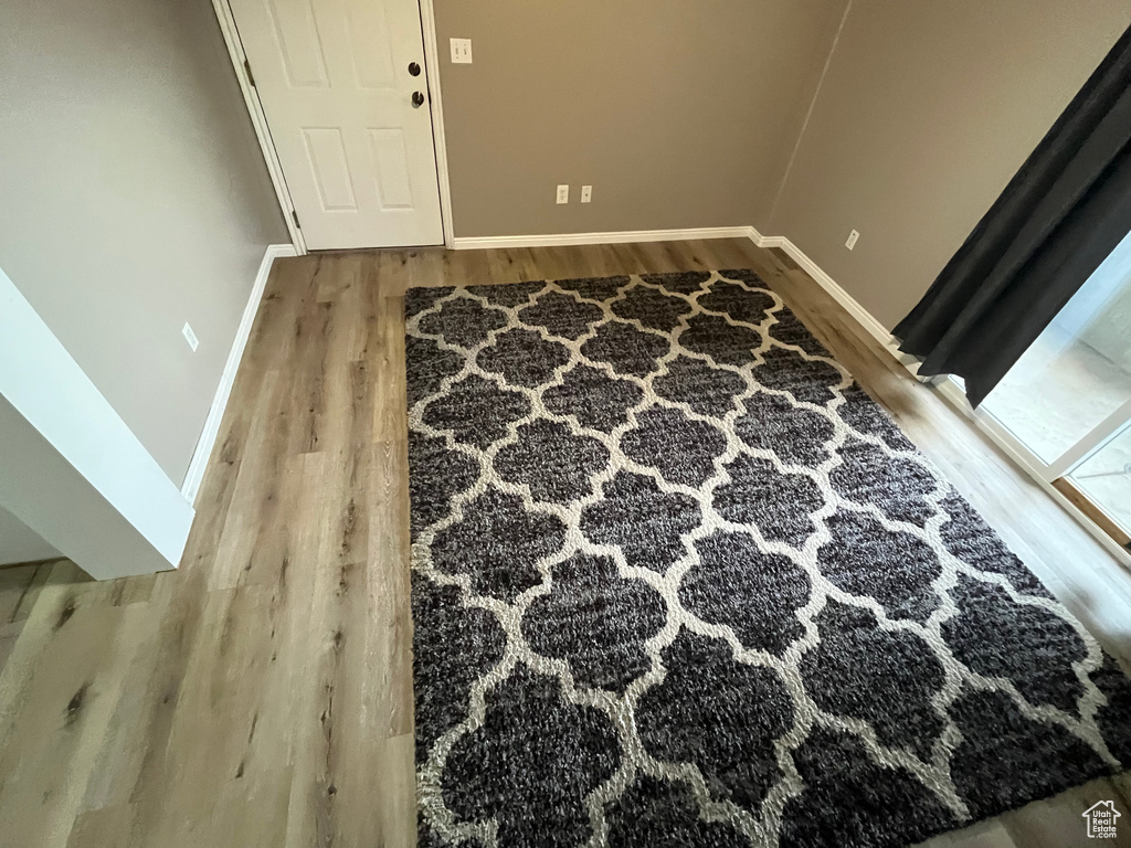 Detailed view of wood finished floors and baseboards