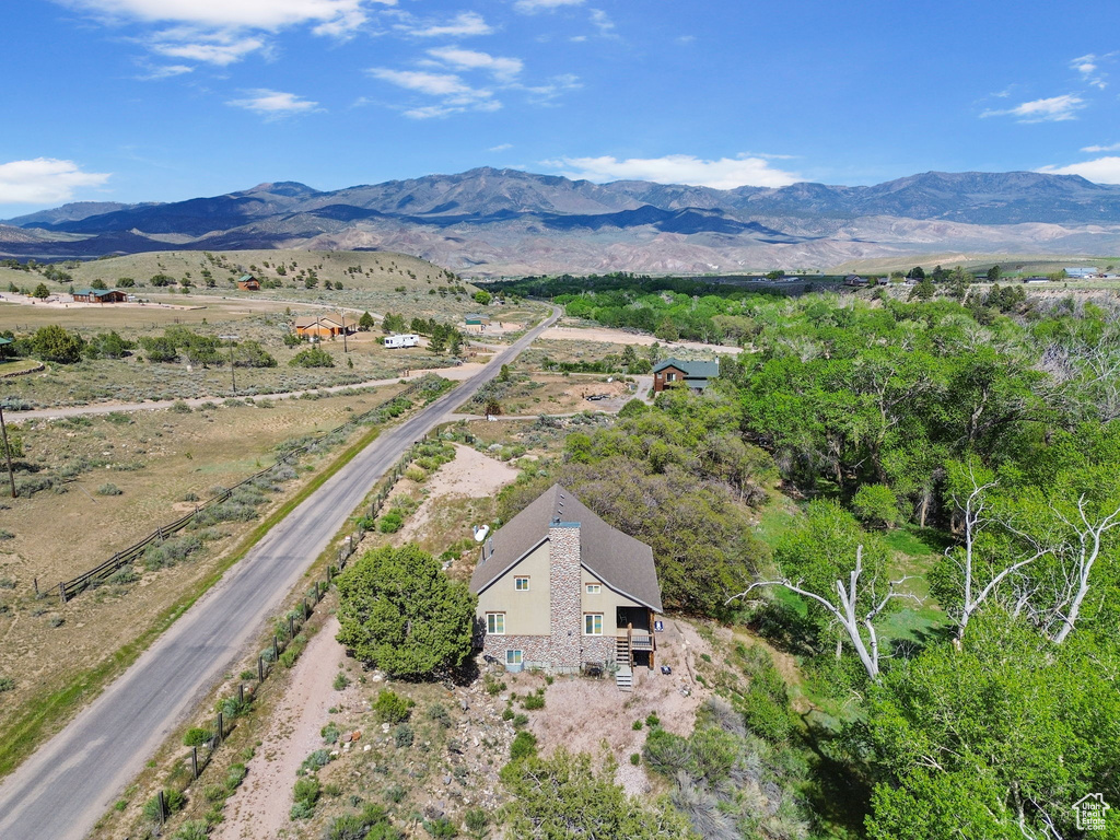 View from above of property with a mountain backdrop