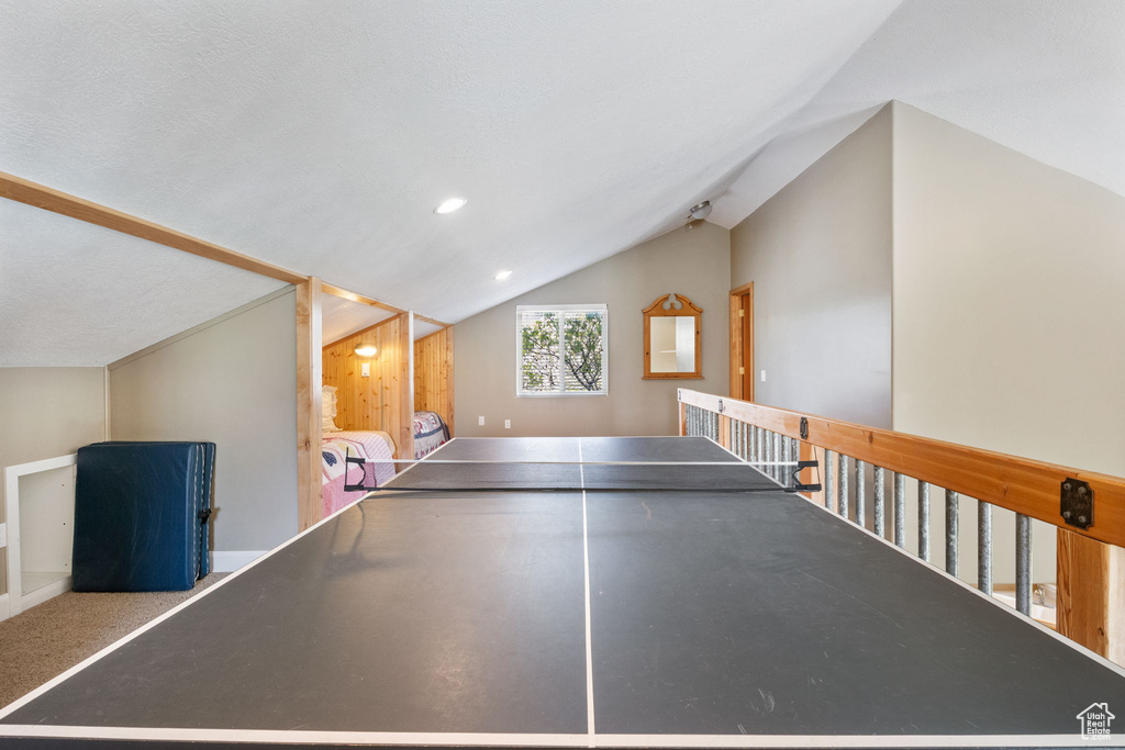 Rec room with vaulted ceiling