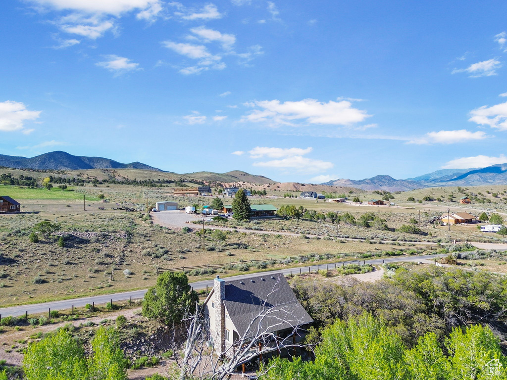 View of mountain backdrop featuring rural landscape