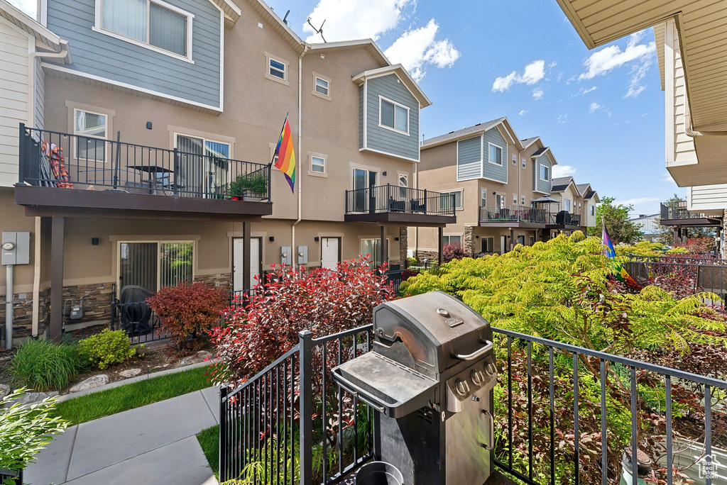Balcony featuring a residential view and area for grilling