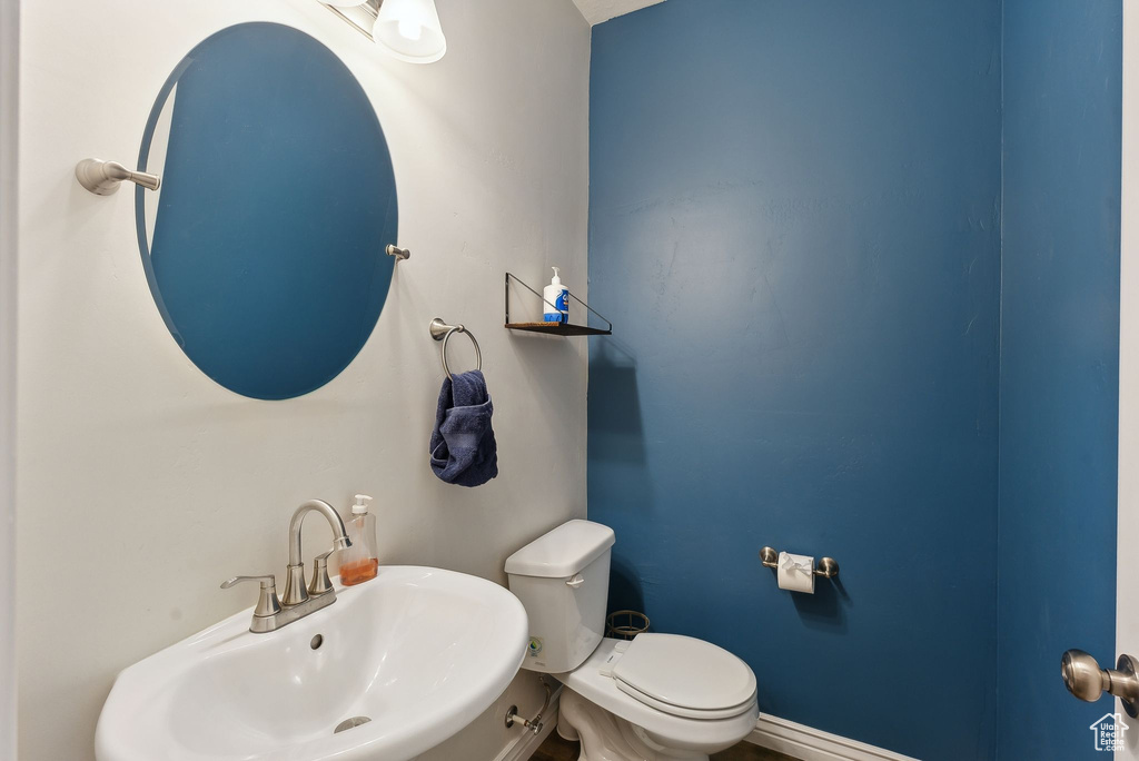 Bathroom featuring a sink and toilet
