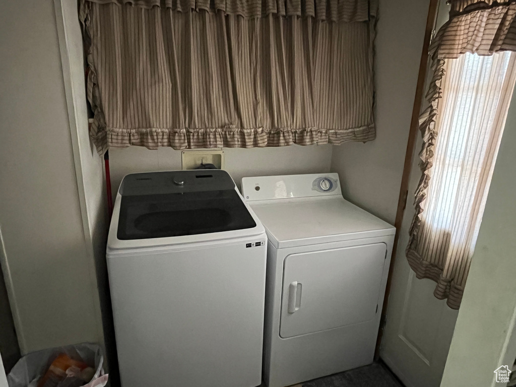 Laundry area with washing machine and clothes dryer