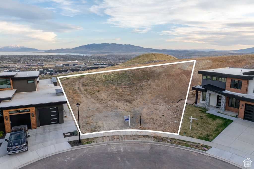 Aerial view of property's location featuring mountains and property parcel outlined