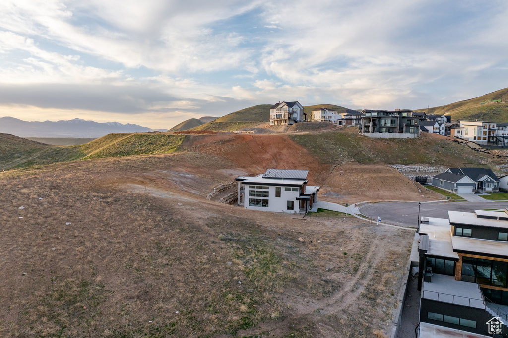 Aerial perspective of suburban area with a mountain backdrop