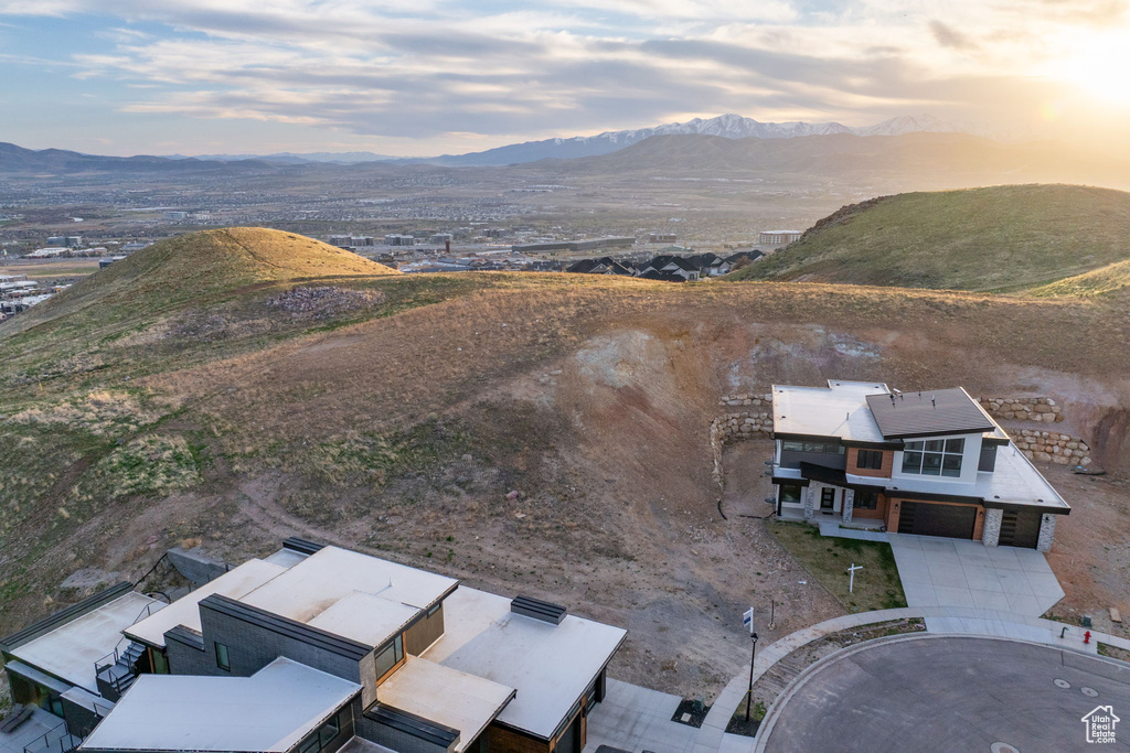 View of subject property featuring a mountainous background
