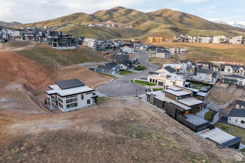Aerial perspective of suburban area featuring a mountainous background