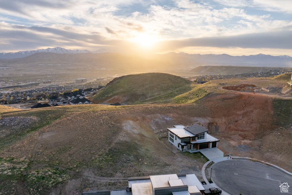 View of subject property with a mountain backdrop