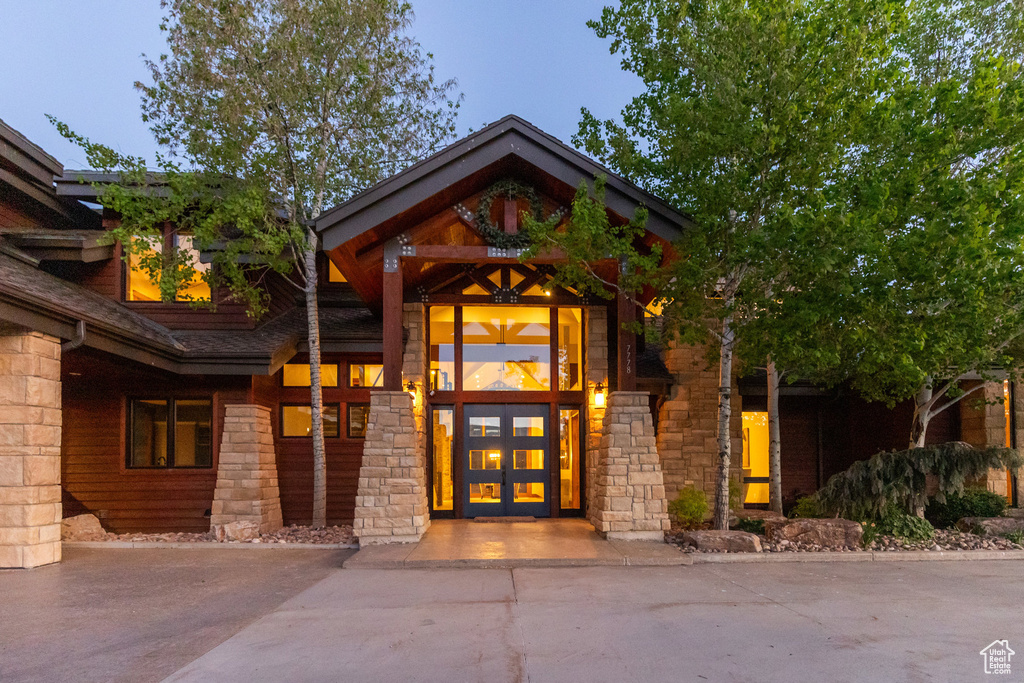 View of exterior entry featuring stone siding
