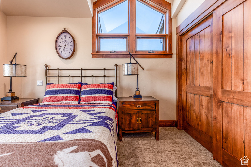 Bedroom with carpet flooring and baseboards