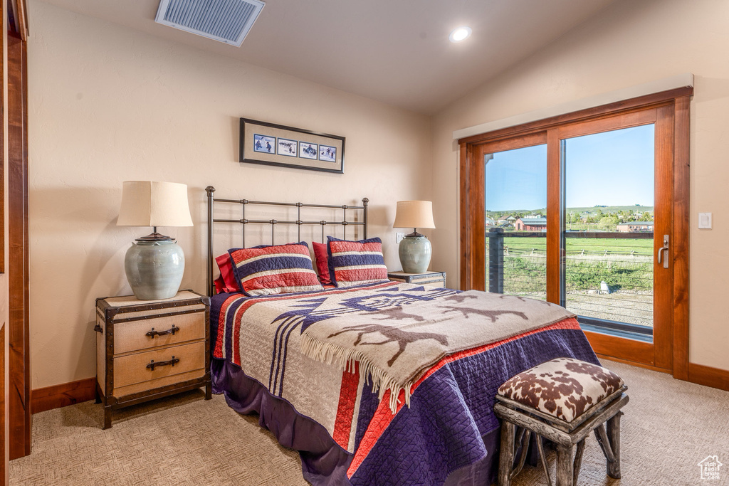 Bedroom featuring access to outside, light carpet, lofted ceiling, baseboards, and recessed lighting