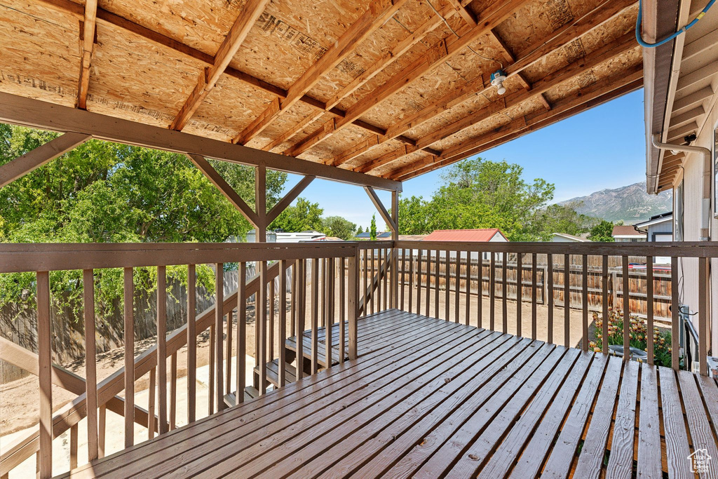 Wooden terrace featuring a mountain view