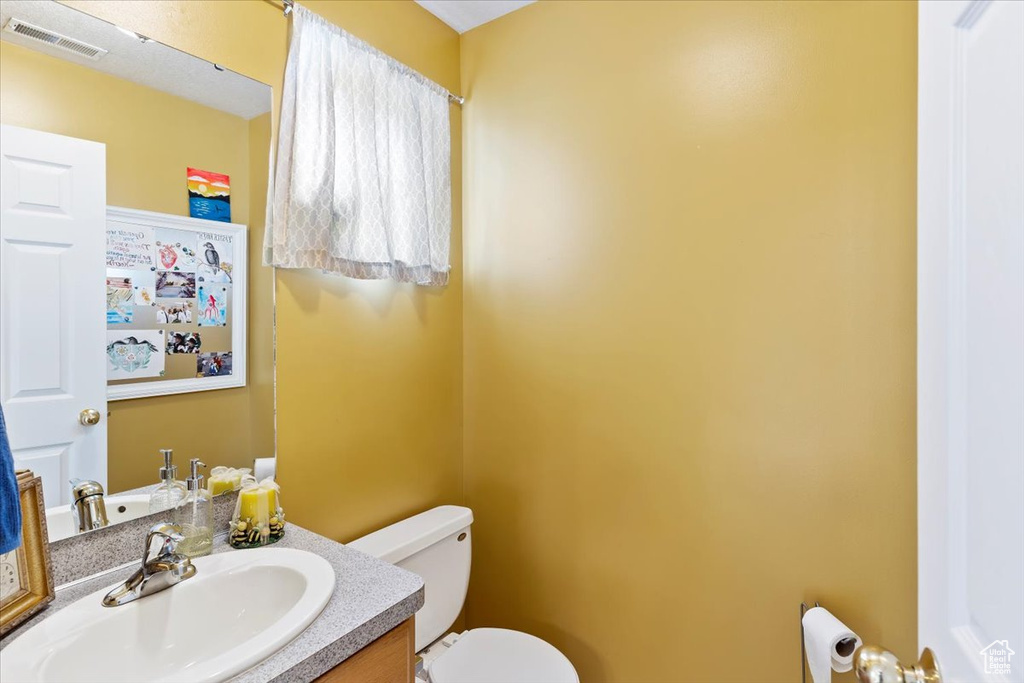Bathroom with toilet and vanity
