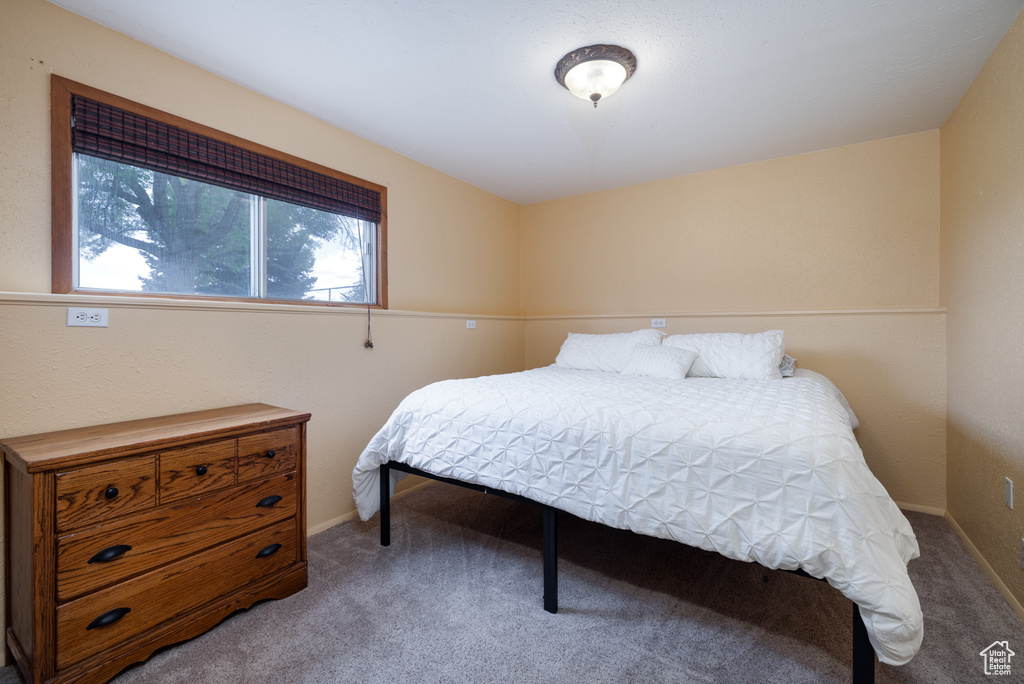 Carpeted bedroom with baseboards