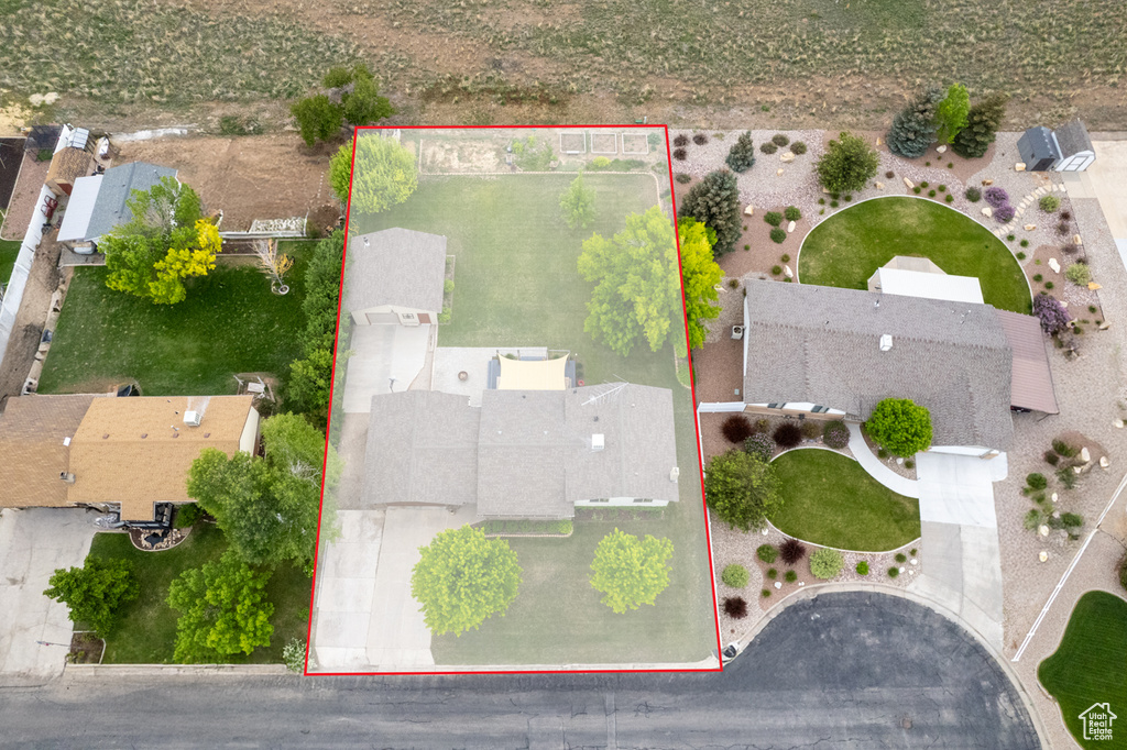 Aerial perspective of suburban area featuring property boundaries highlighted