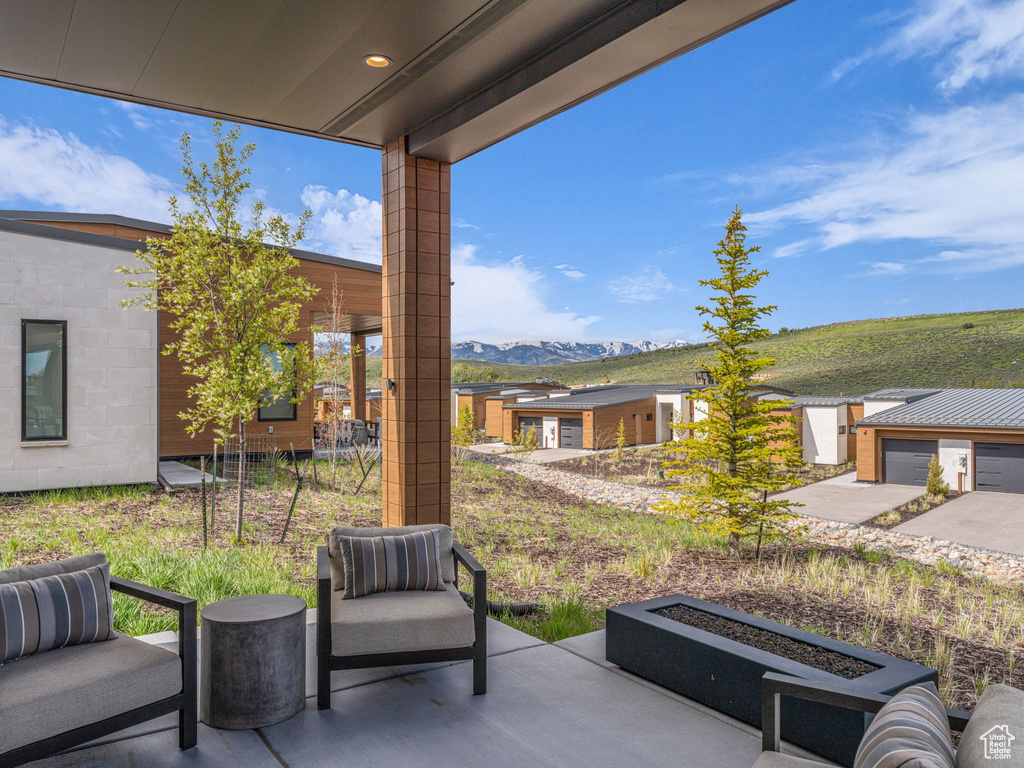 View of patio / terrace with a mountain view