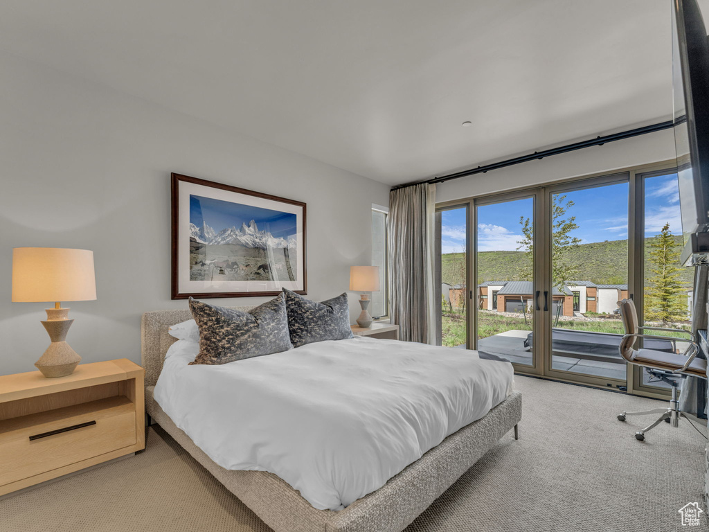 Bedroom featuring carpet floors and access to outside