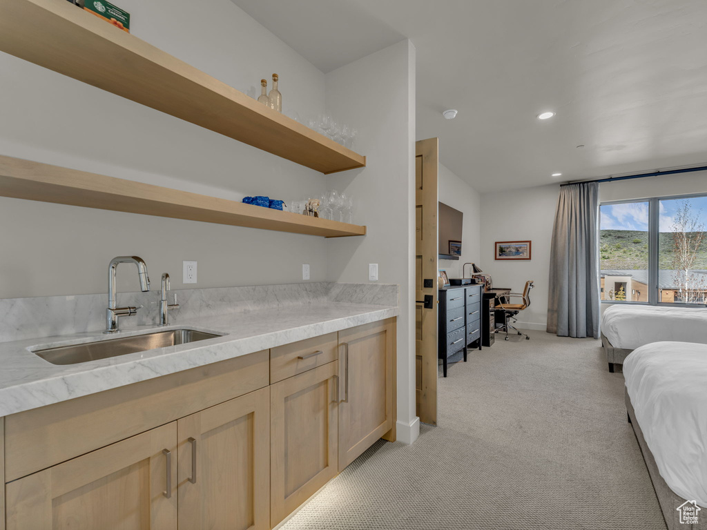 Indoor bar with light carpet, recessed lighting, and baseboards