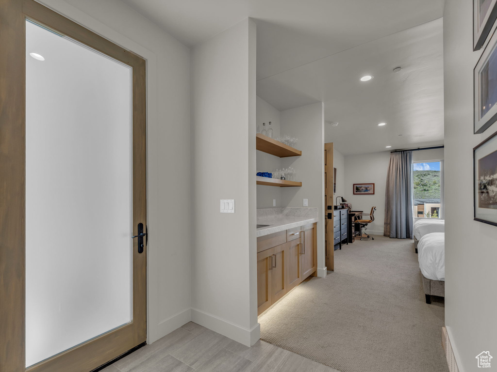 Corridor featuring recessed lighting and baseboards