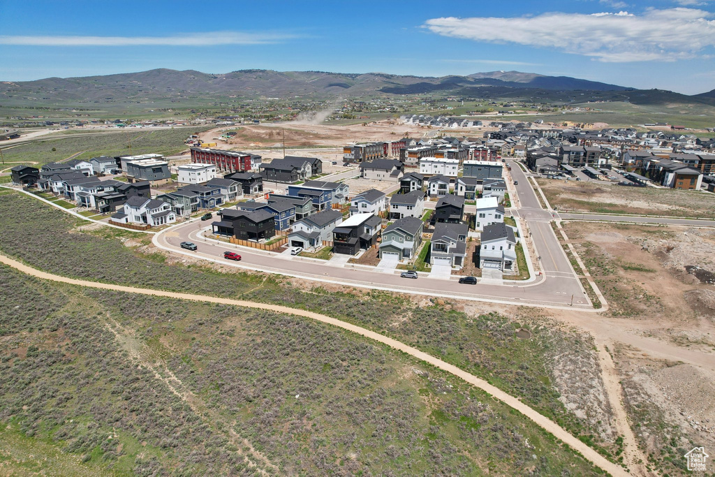 Aerial perspective of suburban area featuring a mountain backdrop