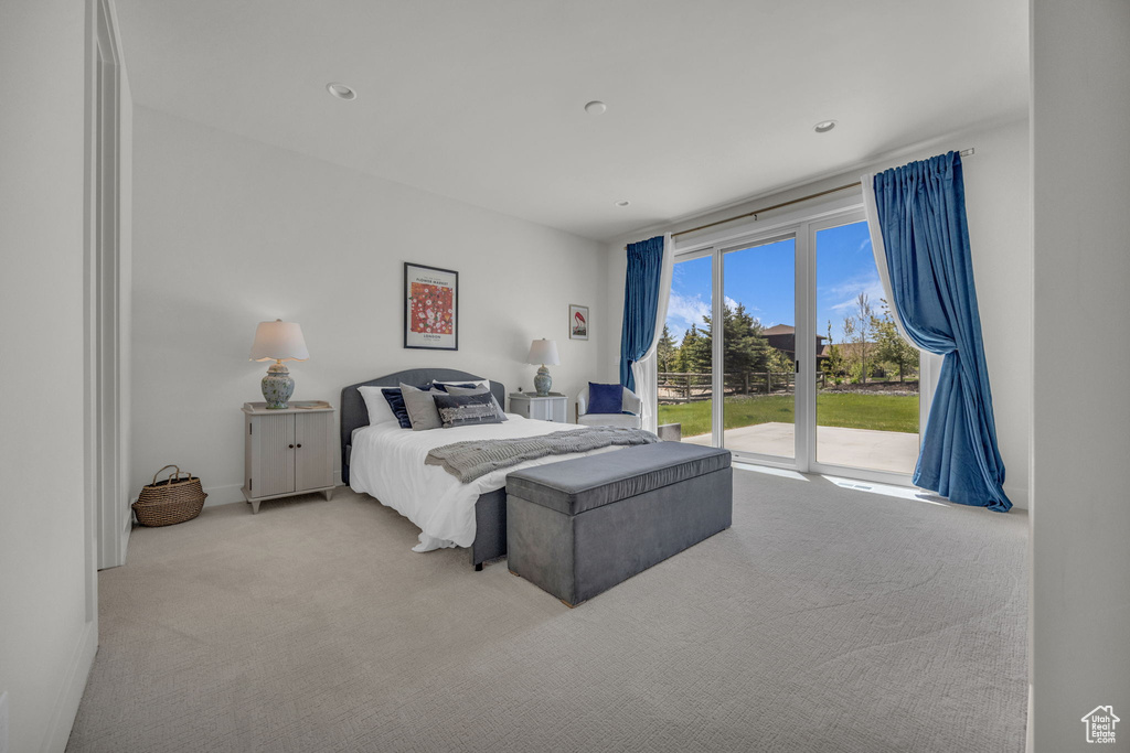 Bedroom featuring access to exterior and carpet