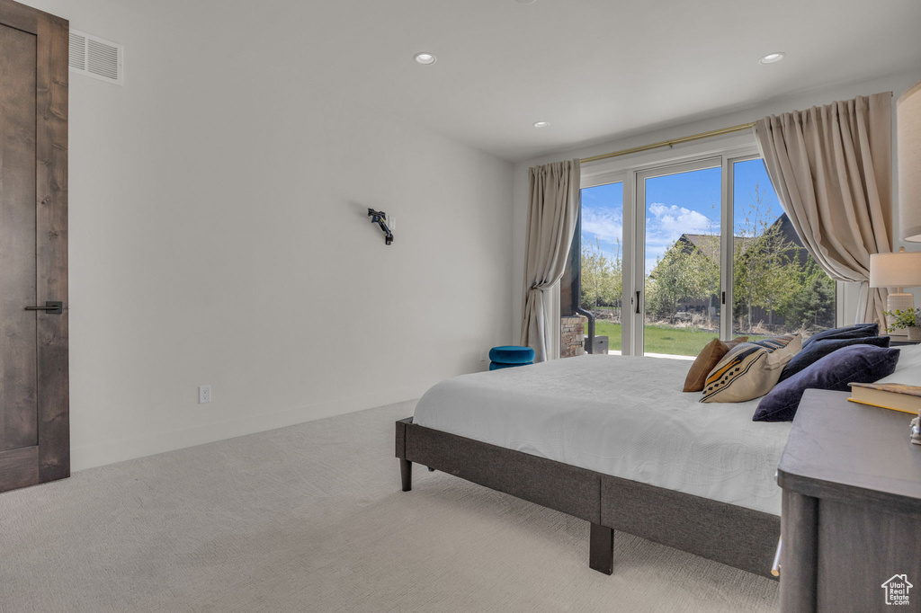 Carpeted bedroom with access to exterior and recessed lighting