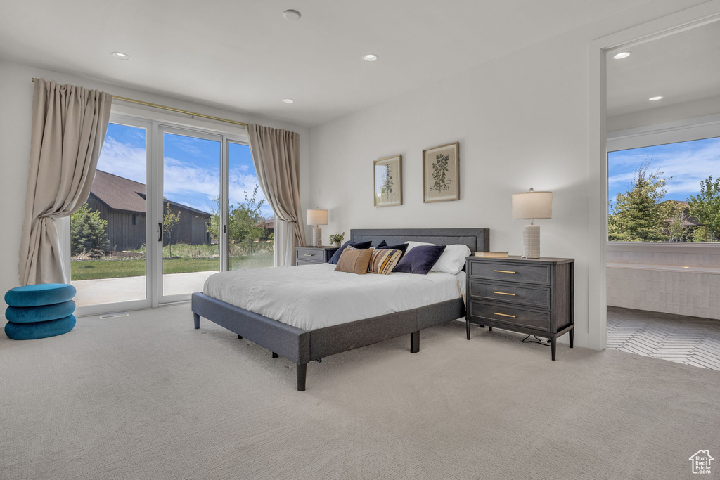 Carpeted bedroom with access to exterior and recessed lighting