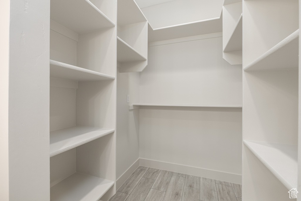 Spacious closet with wood finished floors