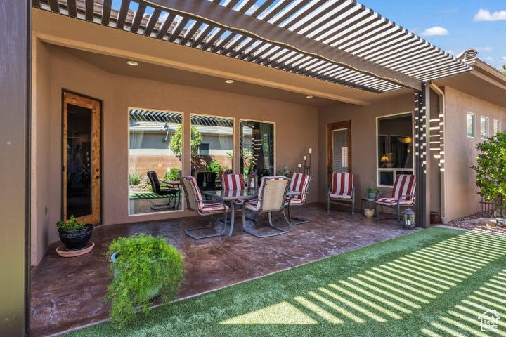 View of patio / terrace with a pergola and outdoor dining space