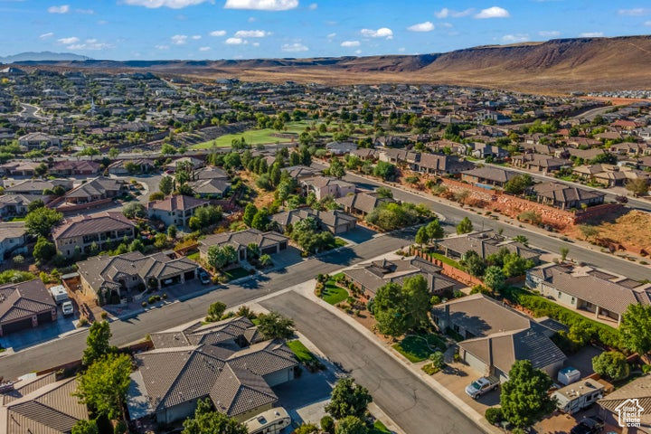 Aerial view of residential area with a mountainous background