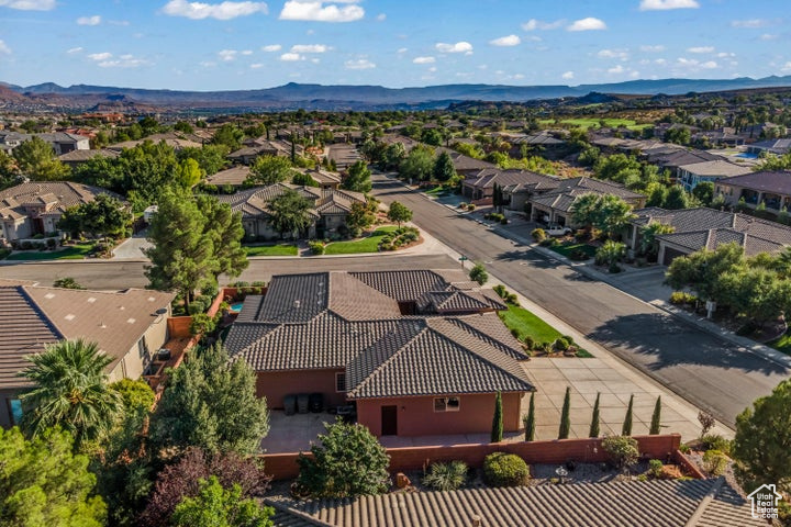 Aerial perspective of suburban area with a mountain backdrop