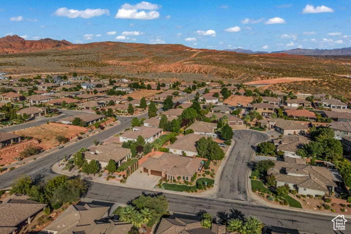 View of property location featuring a mountainous background and nearby suburban area
