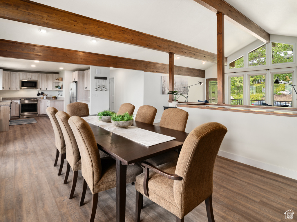 Dining area featuring wood finished floors, baseboards, and recessed lighting