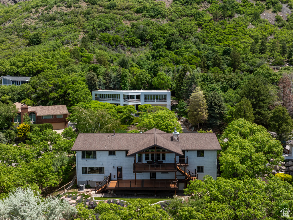 View from above of property featuring a forest