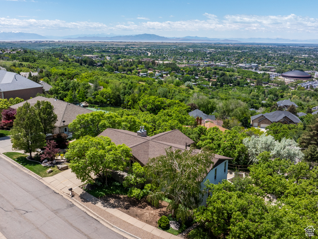 Aerial view of residential area featuring a mountain backdrop