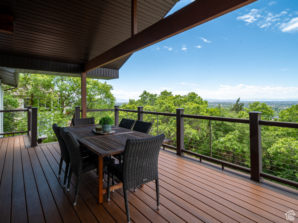 Wooden terrace featuring outdoor dining space