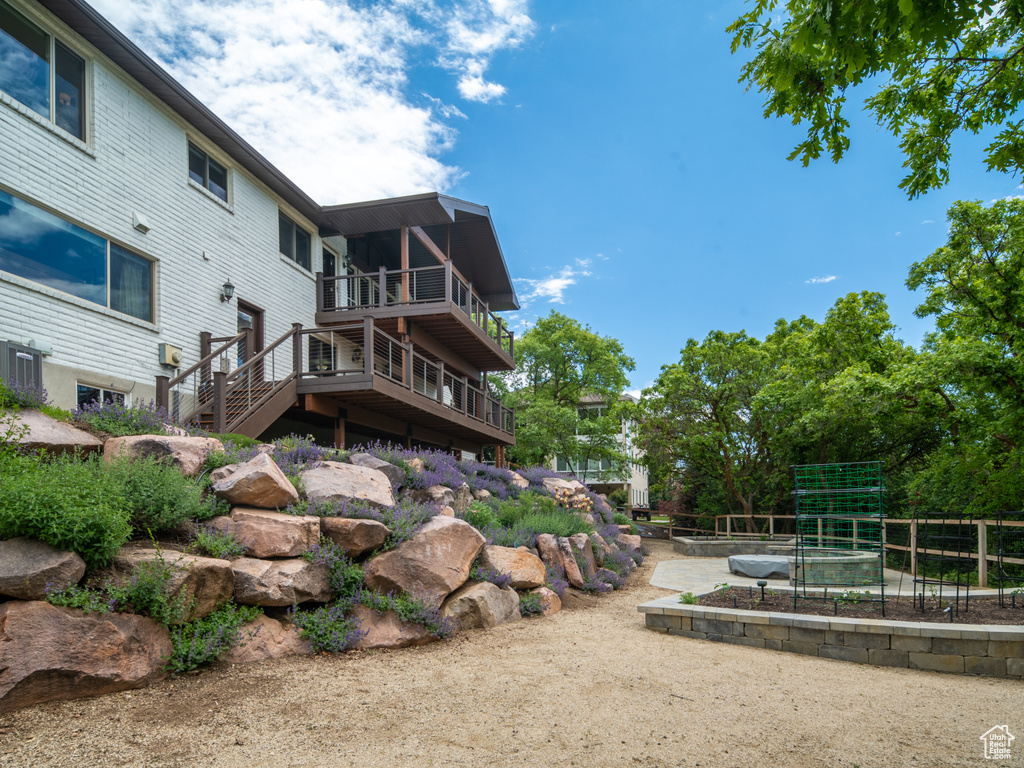 Rear view of house featuring a vegetable garden