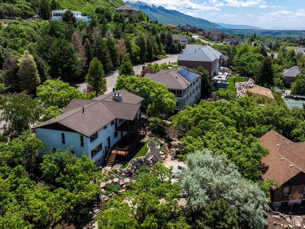 Aerial perspective of suburban area featuring a mountainous background