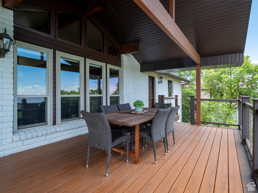 Wooden terrace featuring outdoor dining space