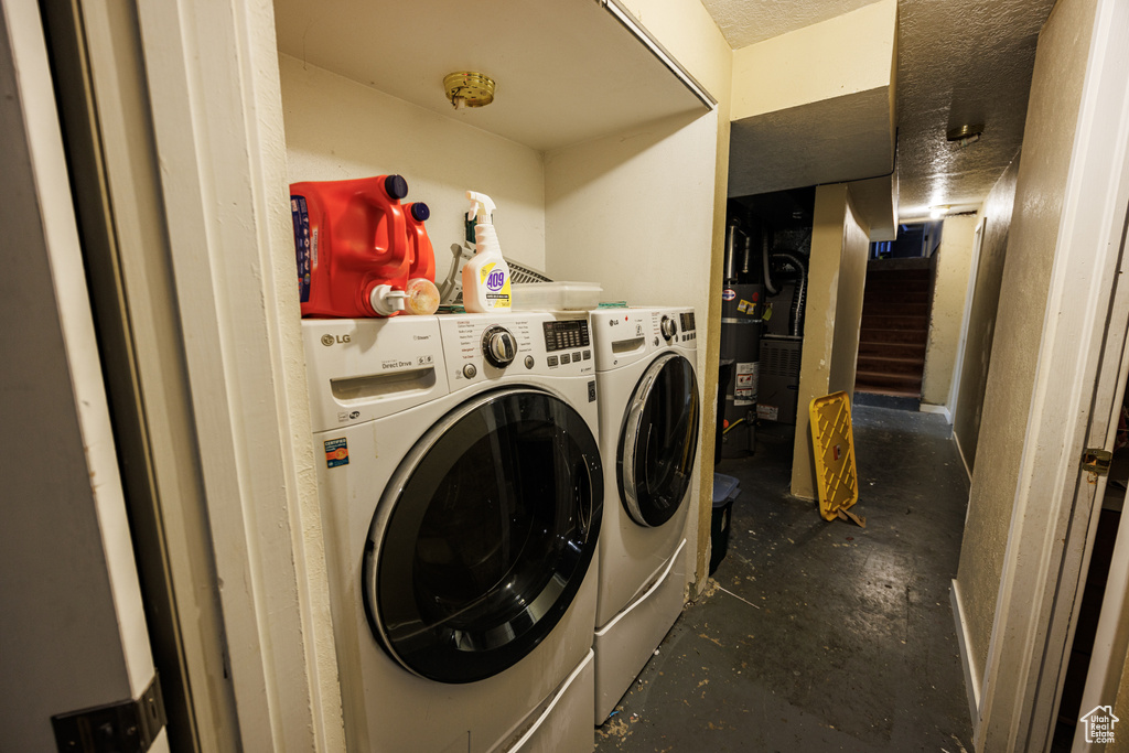 Washroom with washer and clothes dryer