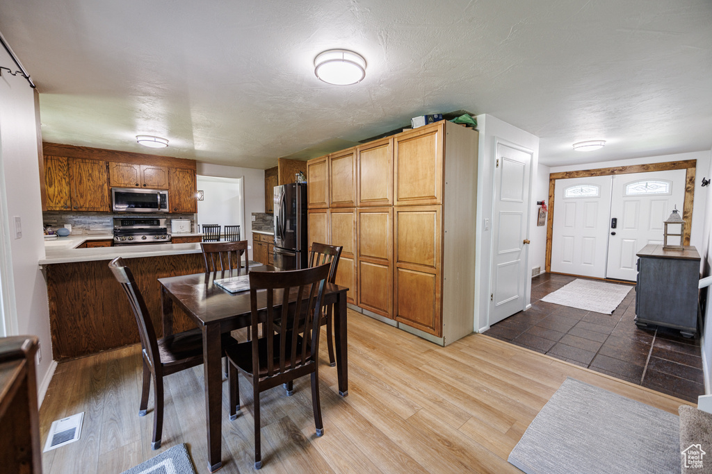 Dining room featuring light wood-style flooring