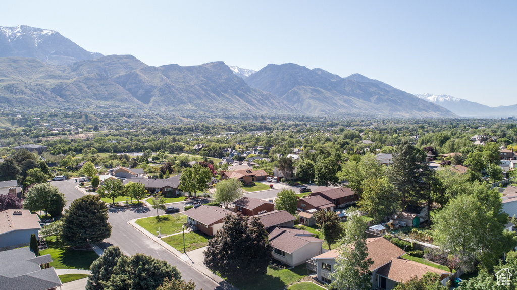 Aerial view of residential area featuring mountains