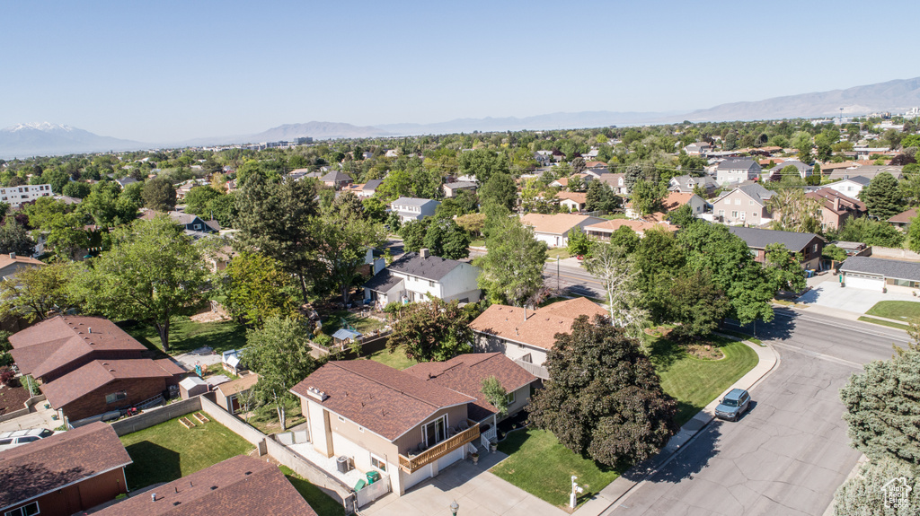 Aerial view of residential area featuring a mountain backdrop